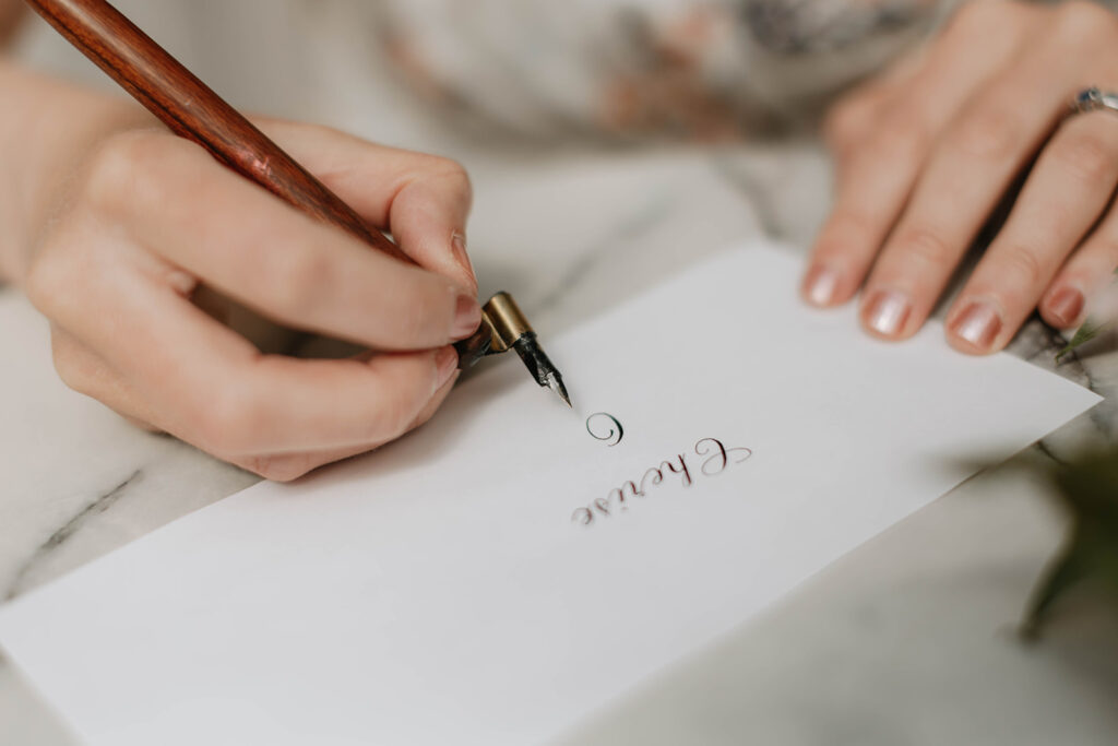 Calligraphy pen poised for writing